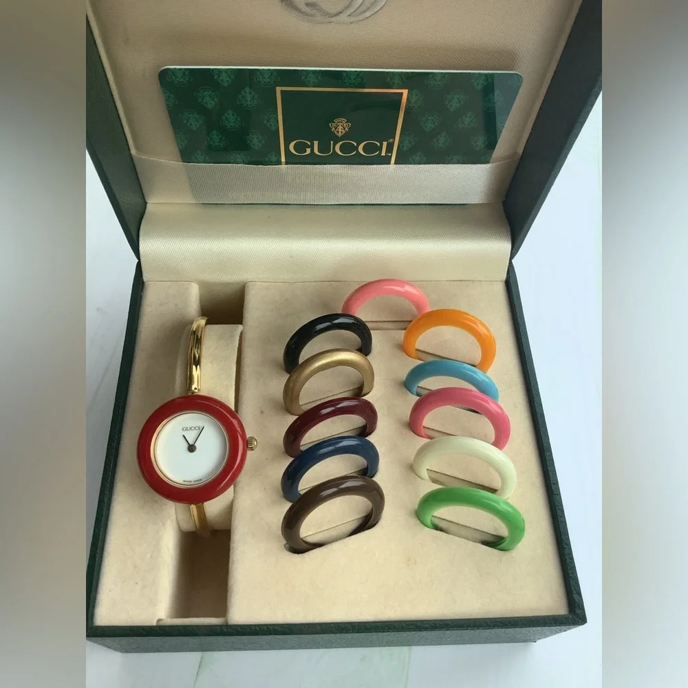 Gucci Women’s Gold Bangle Watch with Interchangeable Color Bezels
